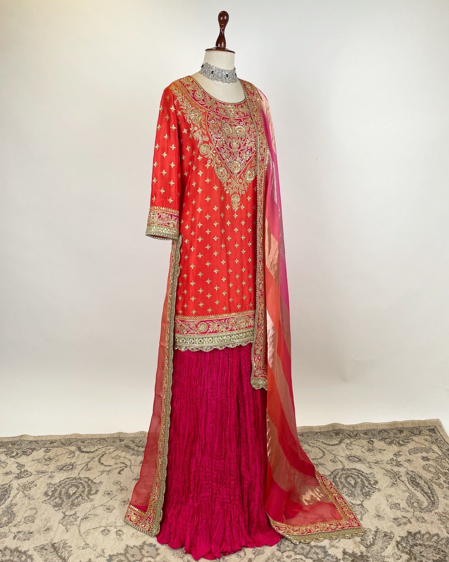 ORANGE SHORT KURTA WITH SILK SHARARA AND AN ORGANZA TISSUE DUPATTA