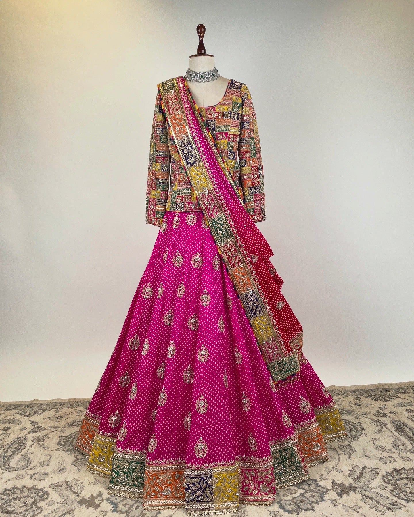 PINK BANDHANI LEHENGA WITH APPLIQUÉ MARODI WORK KOTI-CORSET BLOUSE AND OMBRÉ DUPATTA