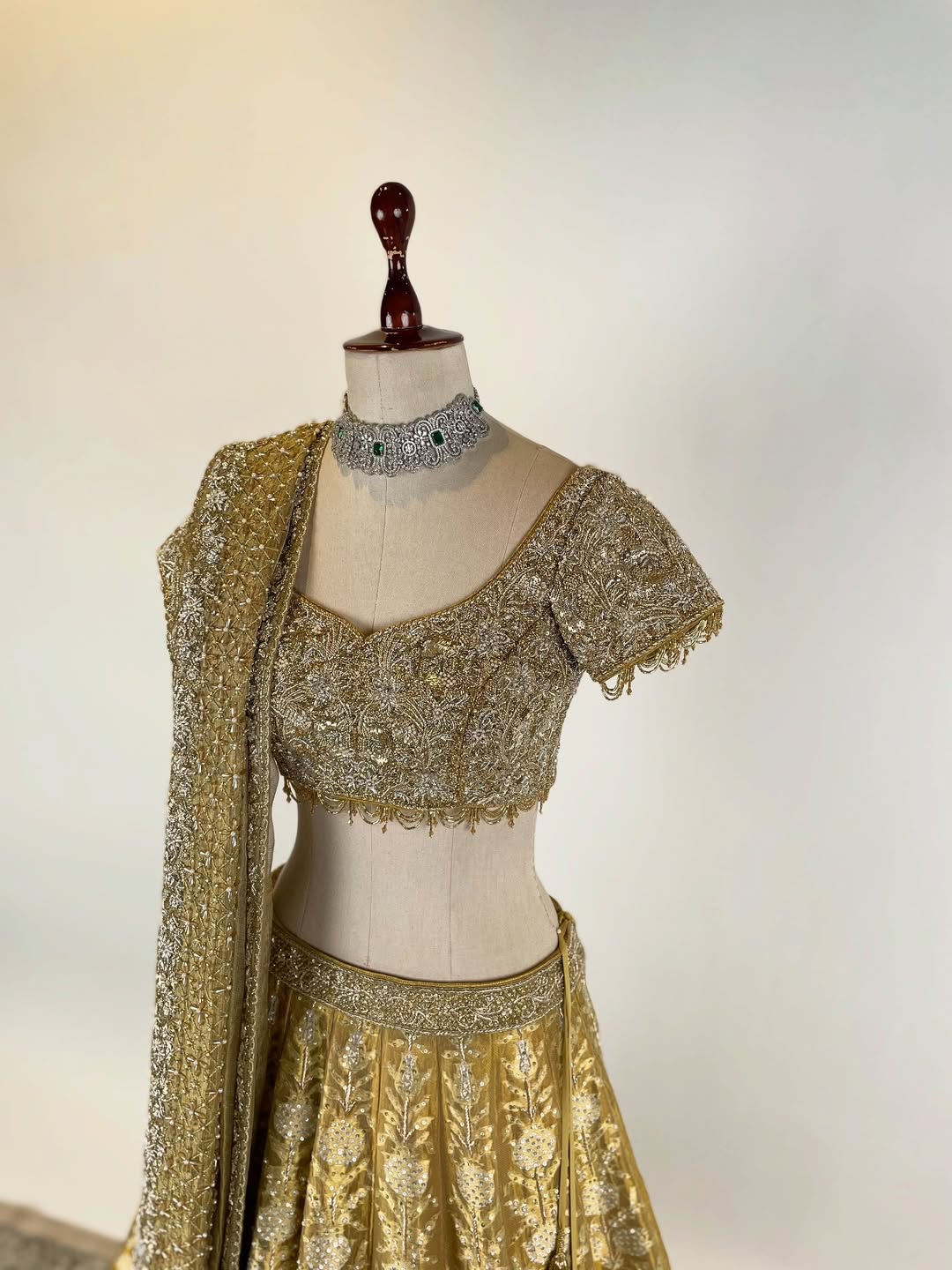 GOLD TISSUE BANARASI LEHENGA WITH ZARDOSI AND BEADS EMBELLISHED BLOUSE AND KOTA DORIA EMBROIDERED DUPATTA