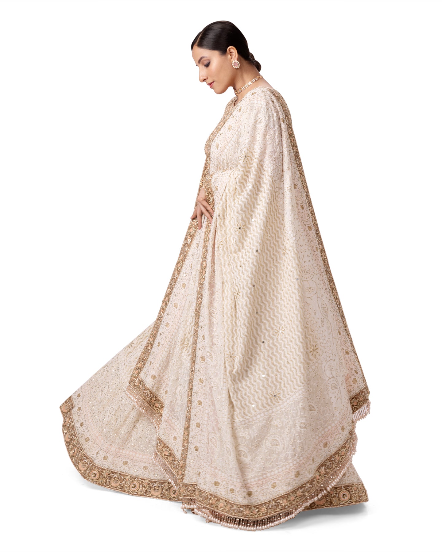 OFF WHITE PASTEL CHIKANKARI- ZARDOSI LEHENGA WITH BACKLESS ZARDOSI BLOUSE