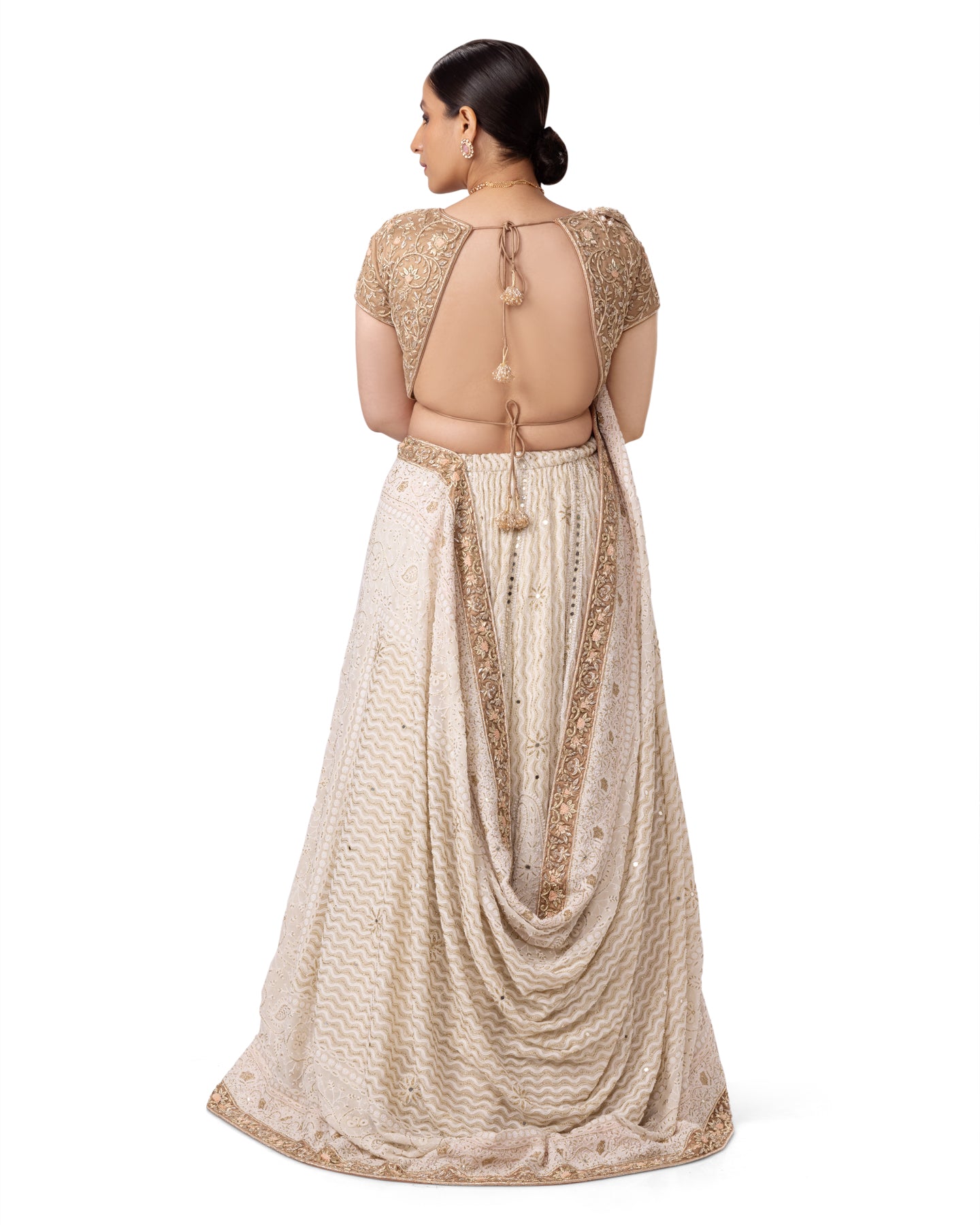 OFF WHITE PASTEL CHIKANKARI- ZARDOSI LEHENGA WITH BACKLESS ZARDOSI BLOUSE