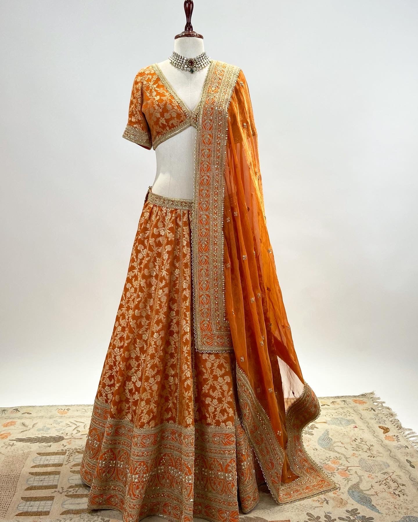 KADWA BROCADE LEHENGA IN RUST ORANGE WITH MARODI WORK