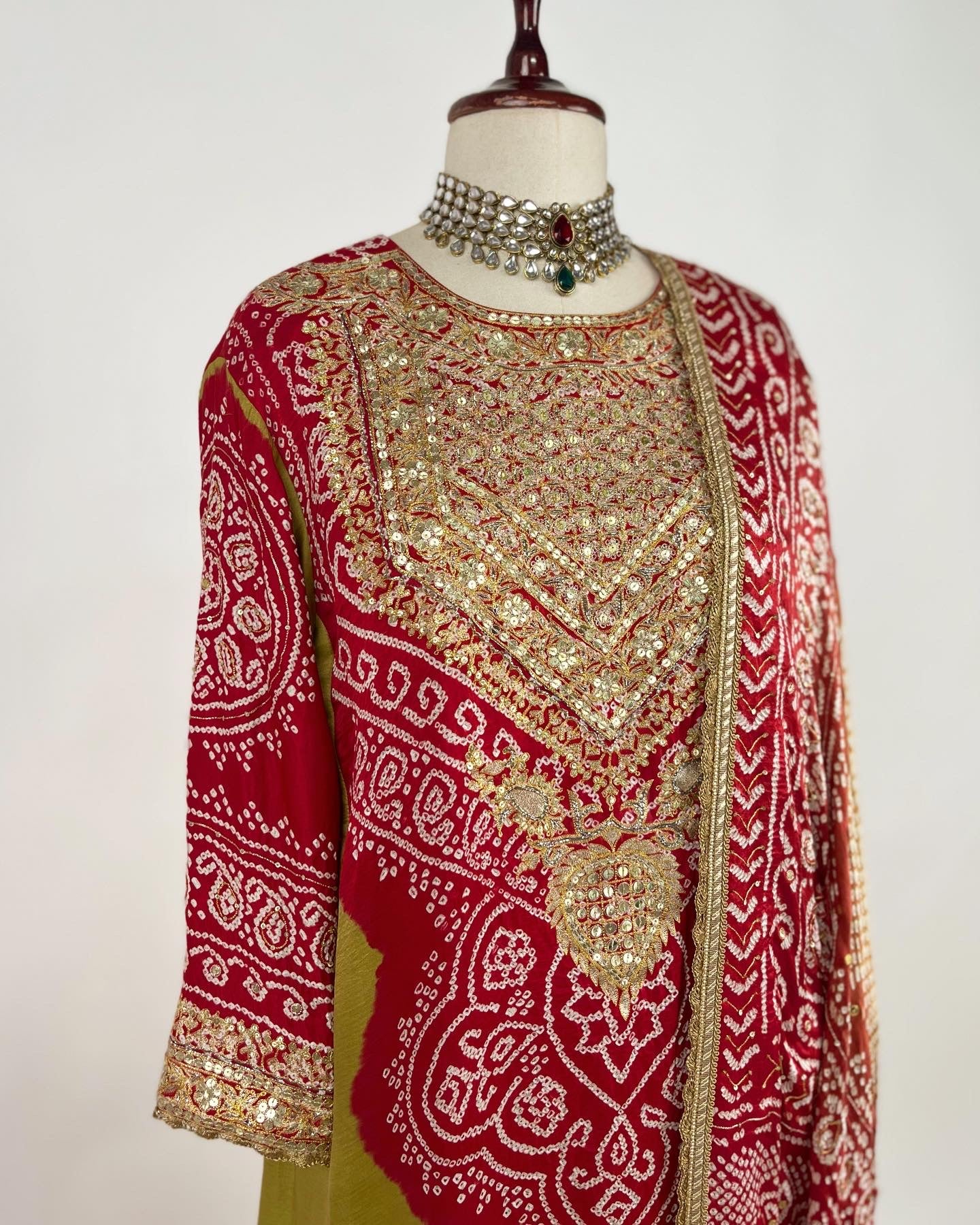 HENNA GREEN AABHA SET WITH RED BANDHEJ & EKTAAR EMBROIDERY