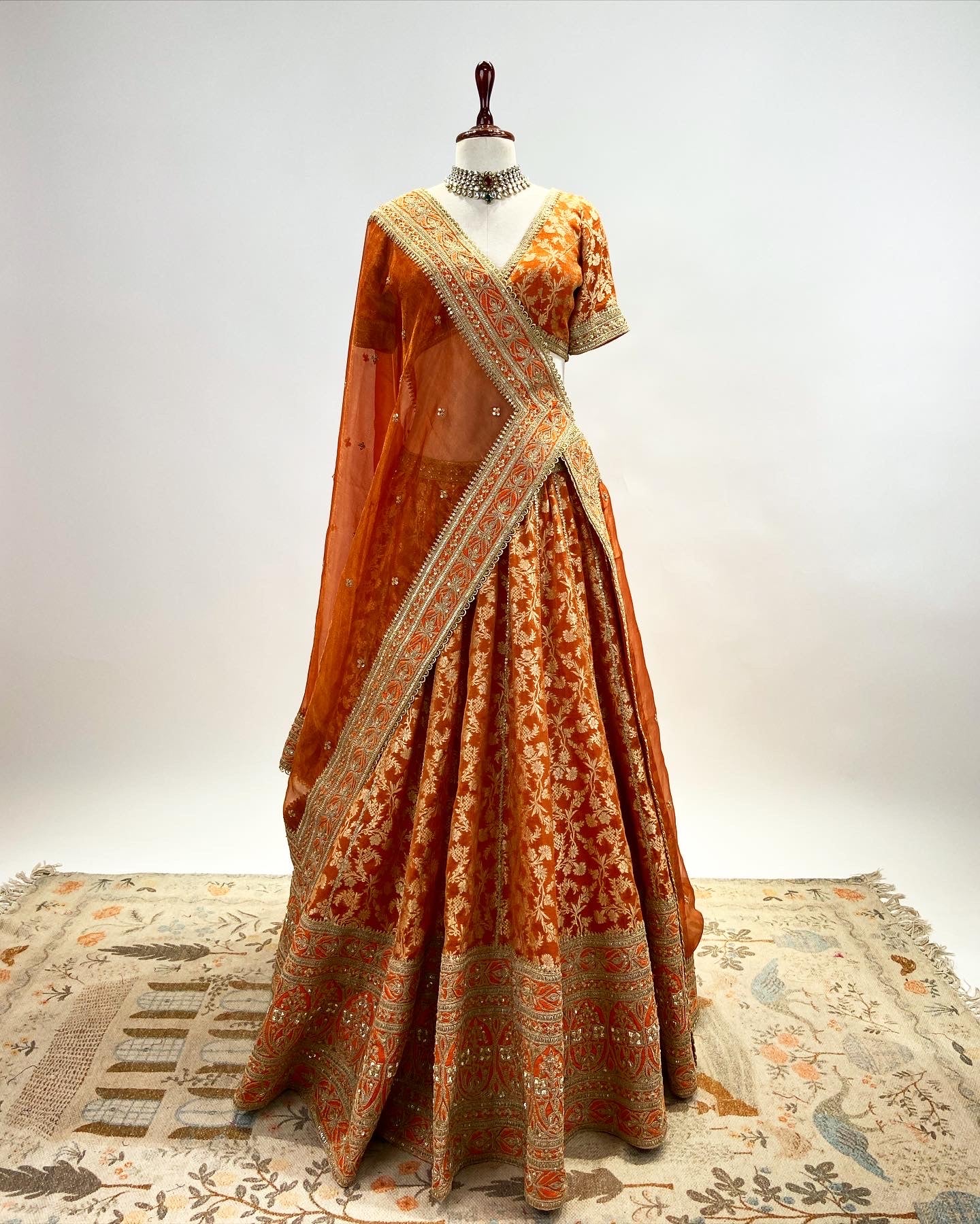 KADWA BROCADE LEHENGA IN RUST ORANGE WITH MARODI WORK