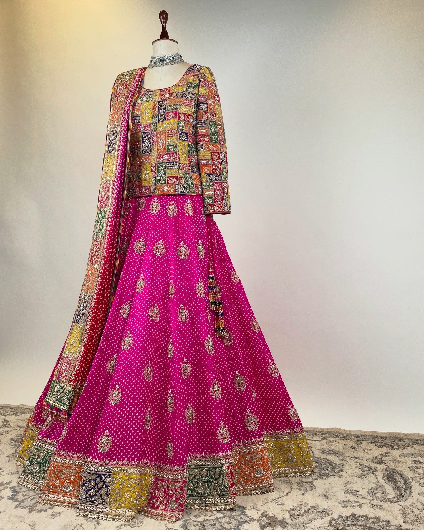 PINK BANDHANI LEHENGA WITH APPLIQUÉ MARODI WORK KOTI-CORSET BLOUSE AND OMBRÉ DUPATTA