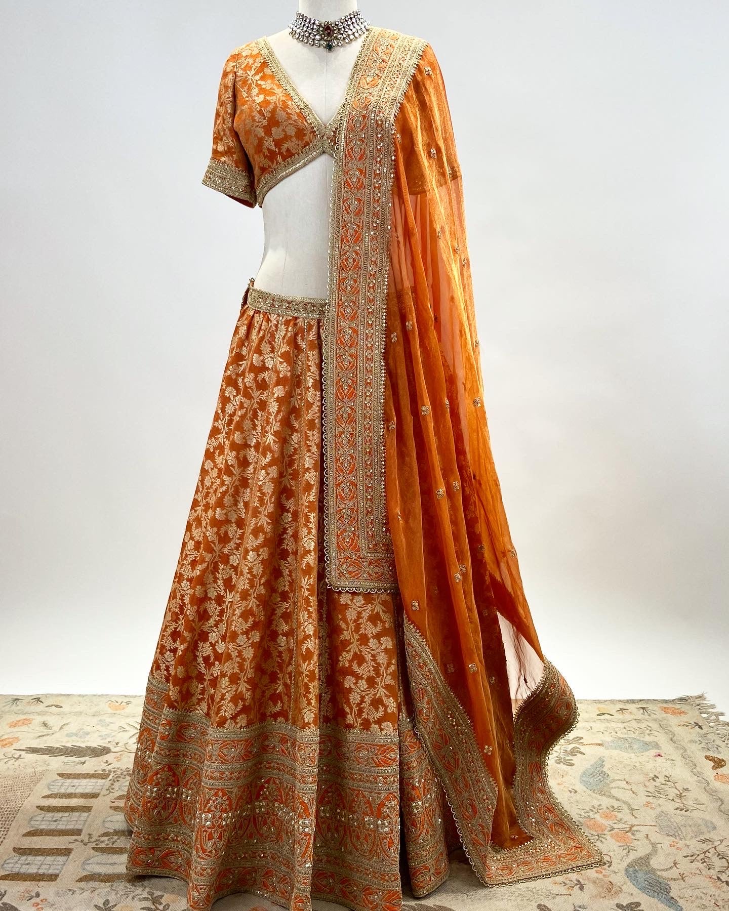 KADWA BROCADE LEHENGA IN RUST ORANGE WITH MARODI WORK