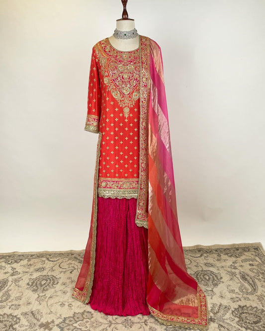 ORANGE SHORT KURTA WITH SILK SHARARA AND AN ORGANZA TISSUE DUPATTA
