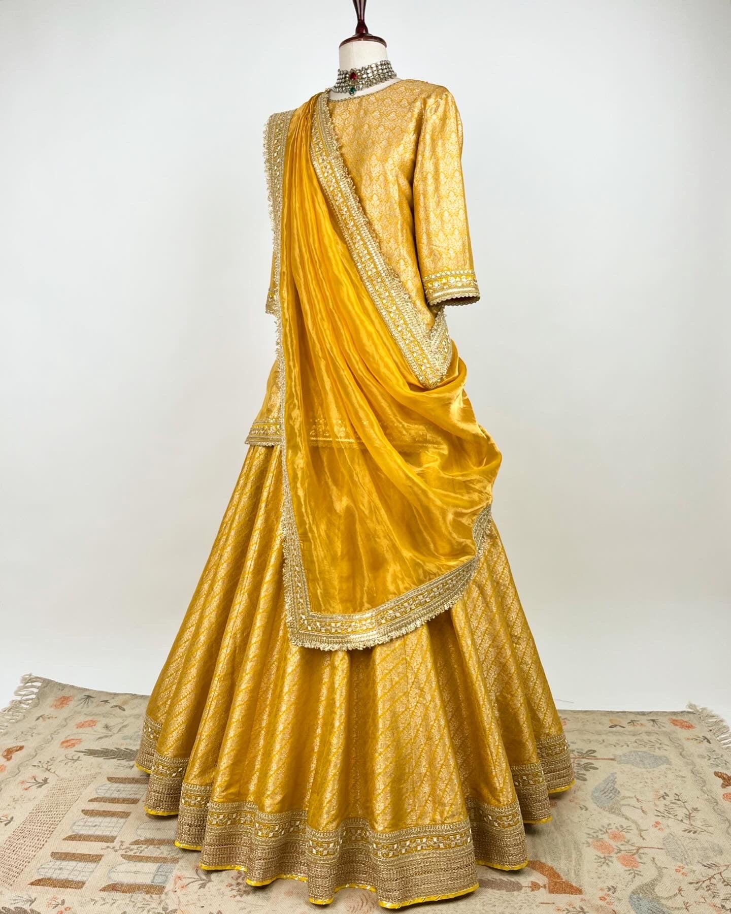 MUSTARD BROCADE LEHENGA WITH SHORT KURTA AND TISSUE DUPATTA