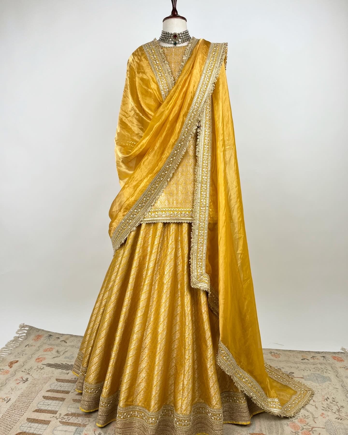 MUSTARD BROCADE LEHENGA WITH SHORT KURTA AND TISSUE DUPATTA