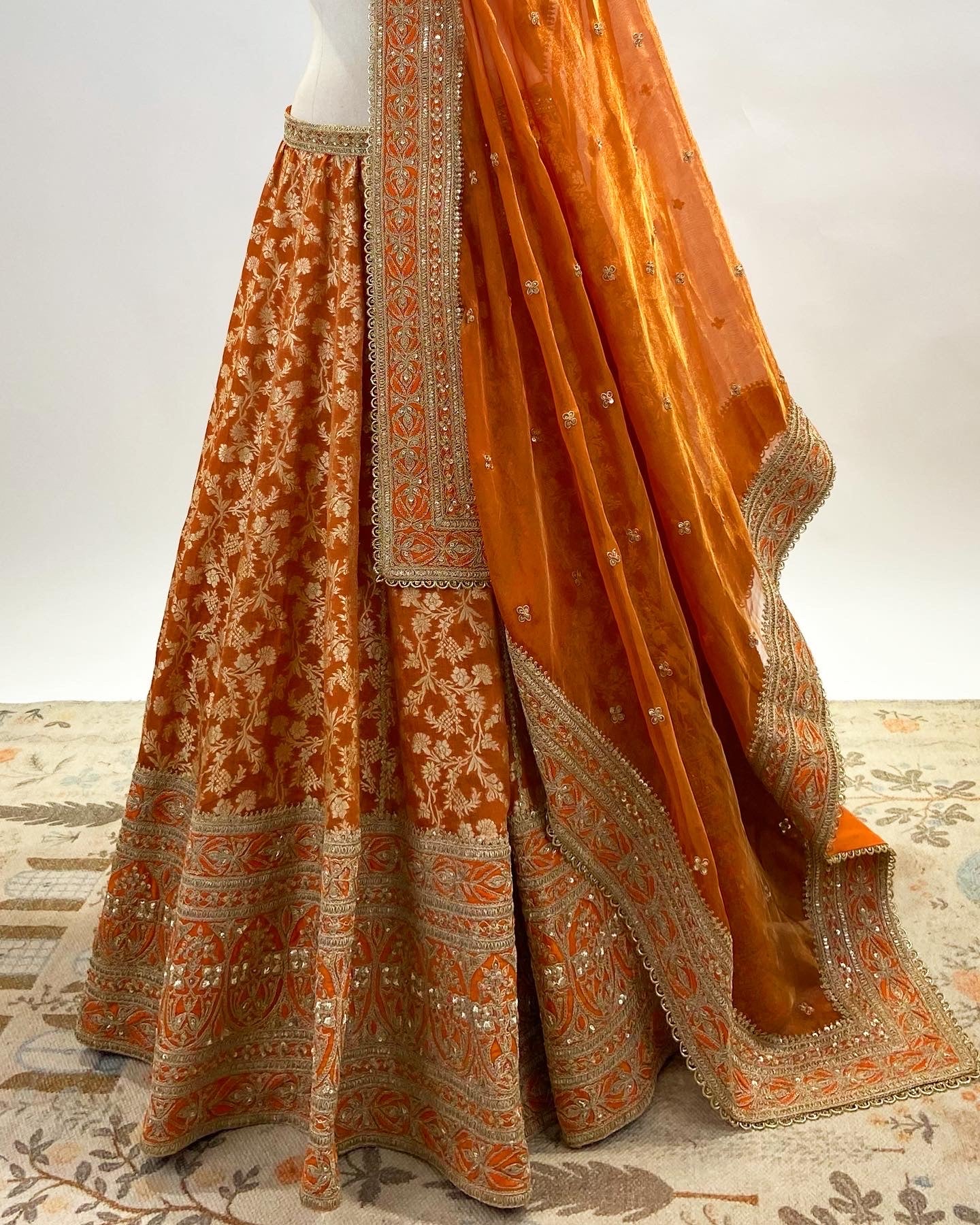 KADWA BROCADE LEHENGA IN RUST ORANGE WITH MARODI WORK