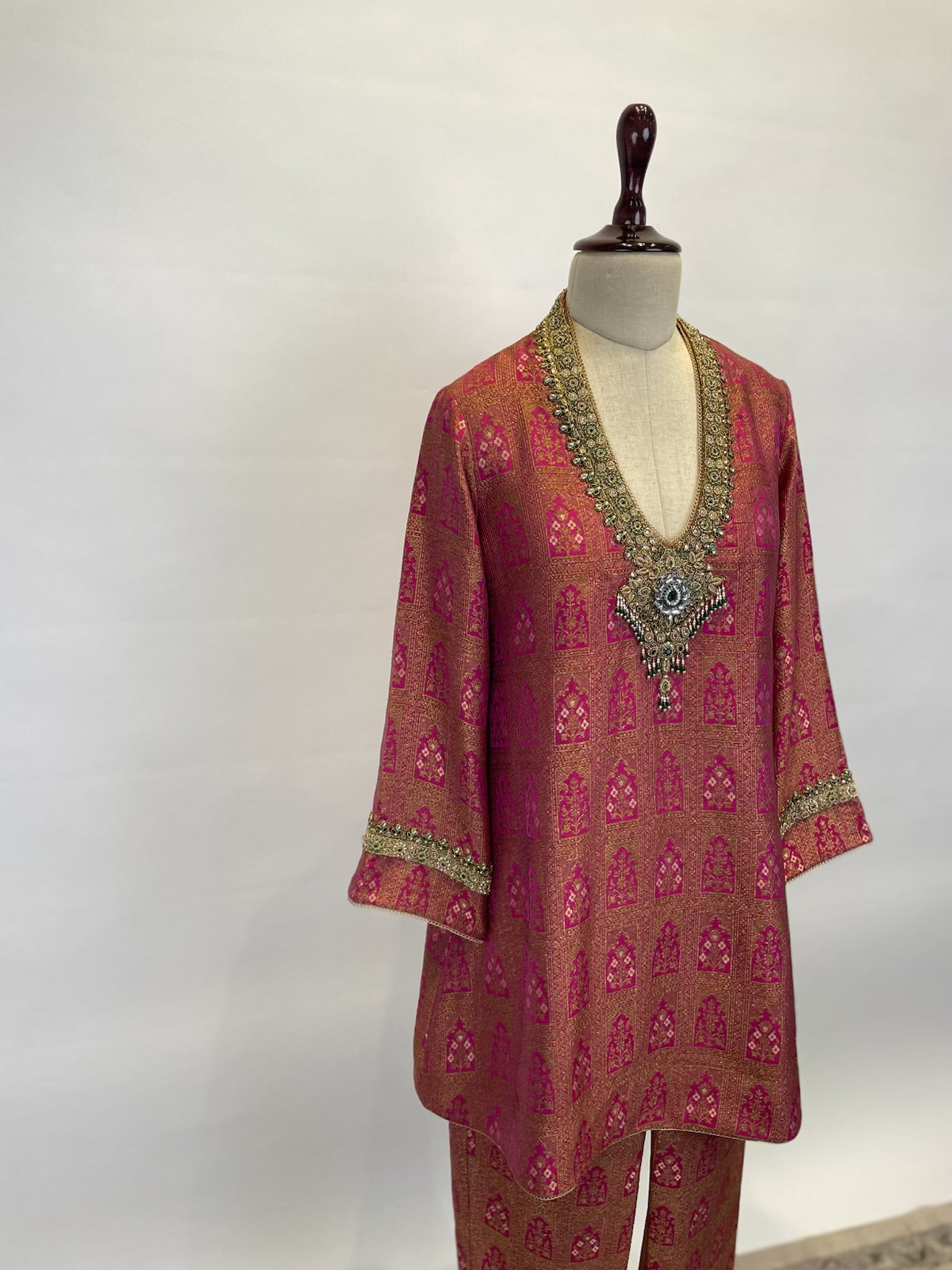 Banarasi Brocade Kurta Set Adorned With Intricate Zardosi And Emerald Detailing.