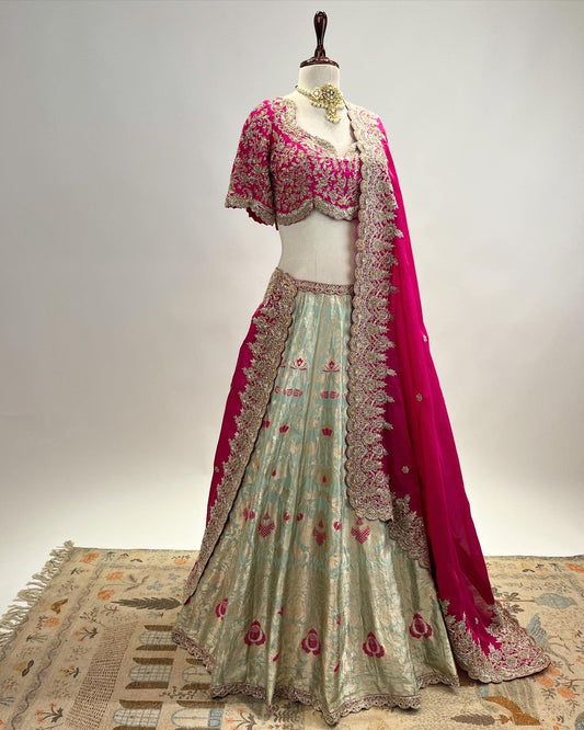 PASTEL TIFFANY BLUE BANARASI KADWA MEENA LEHENGA WITH MAGENTA DUPATTA & ZARDOSI WORK