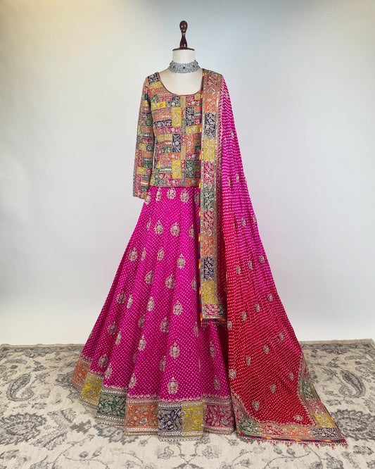 PINK BANDHANI LEHENGA WITH APPLIQUÉ MARODI WORK KOTI-CORSET BLOUSE AND OMBRÉ DUPATTA