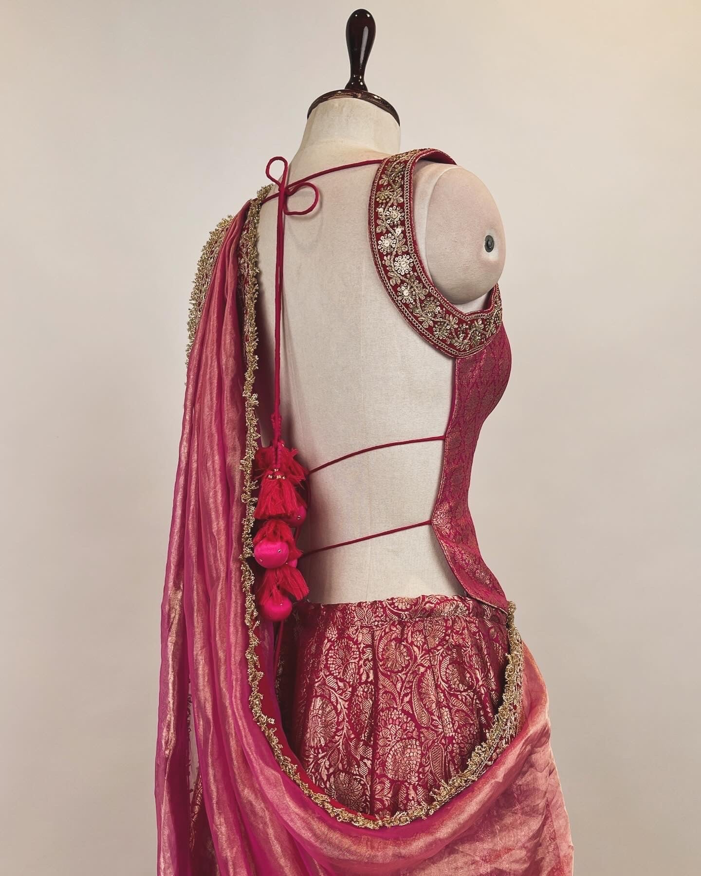 BROCADE LEHENGA WITH BACKLESS TASSLED TOP