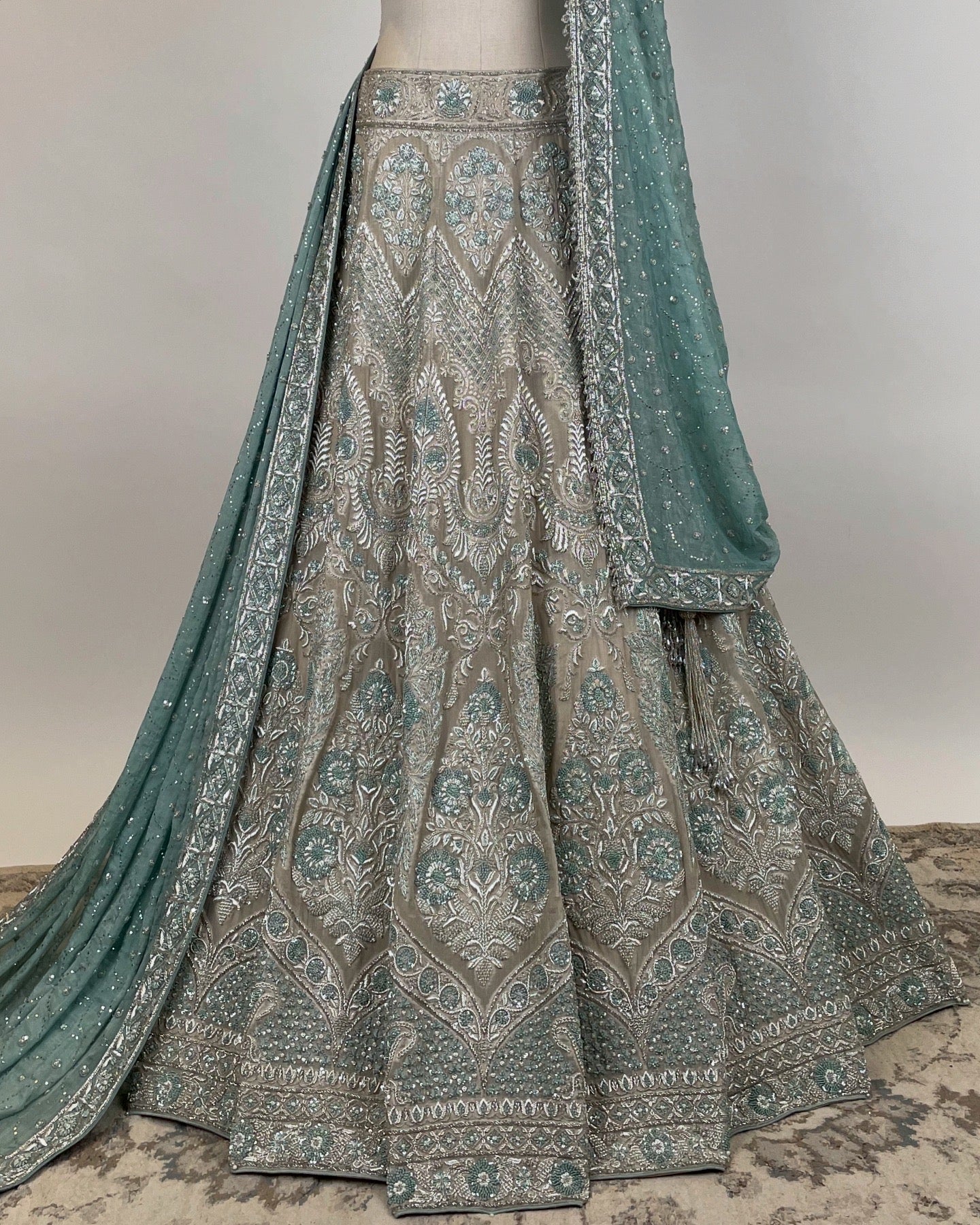 SILVER LEHENGA WITH ZARDOZI & FRENCH KNOT WORK PAIRED WITH SILVER RHINESTONE EMBELLISHED BLOUSE AND BLUE DUPATTA