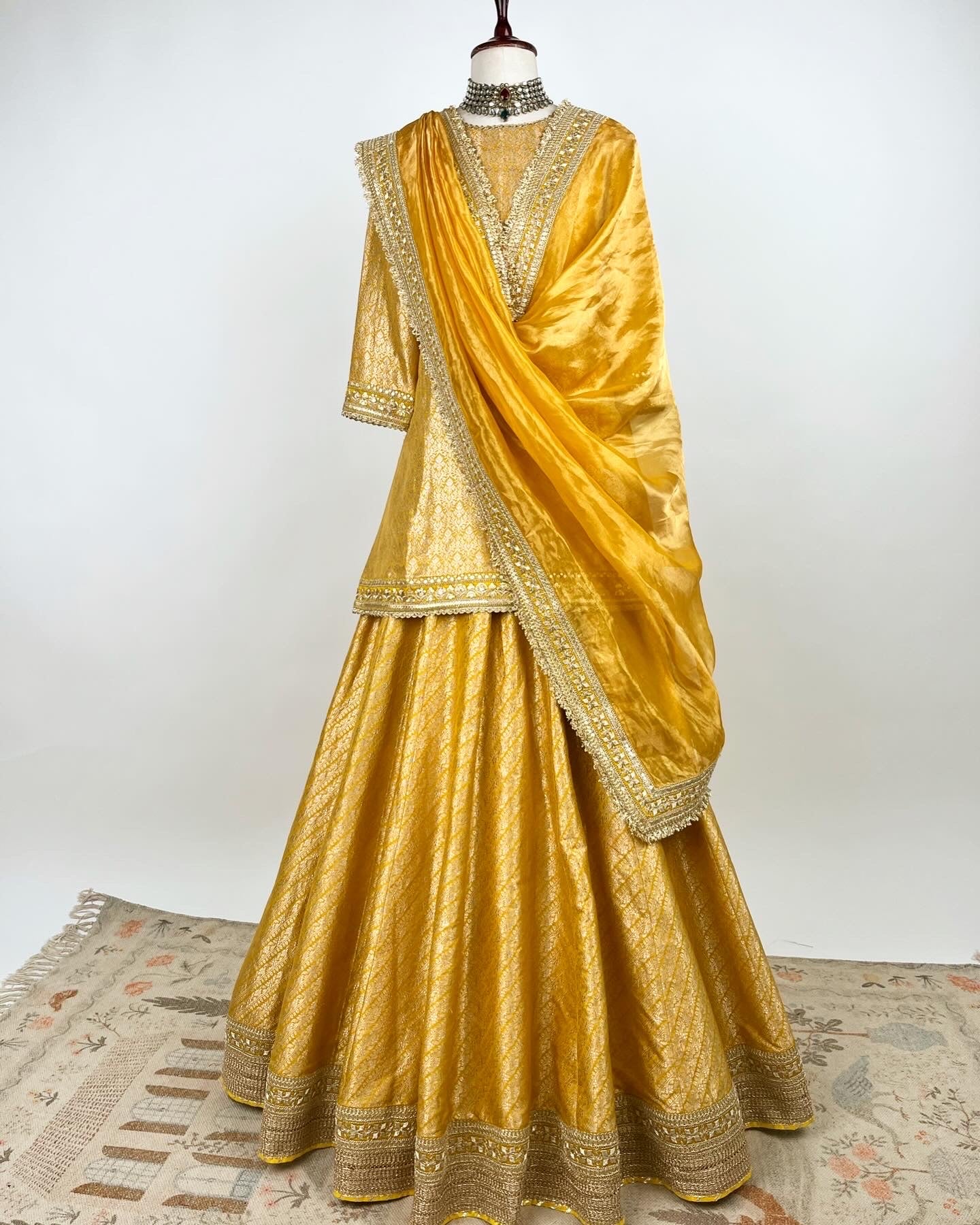 MUSTARD BROCADE LEHENGA WITH SHORT KURTA AND TISSUE DUPATTA