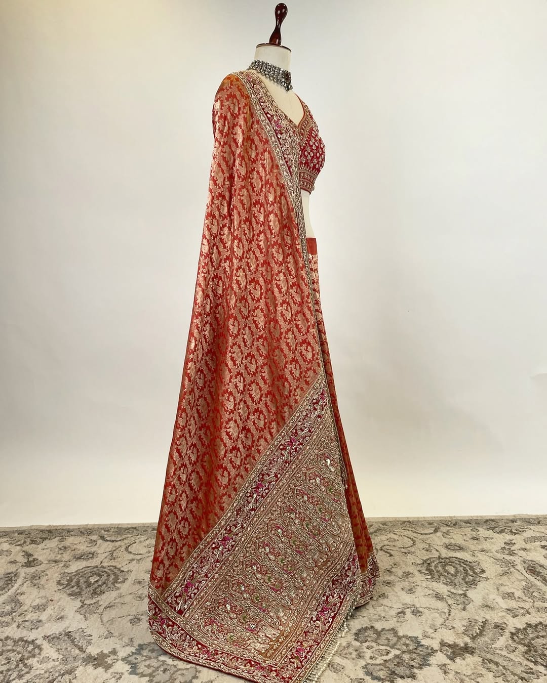 RUST ORANGE BROCADE ZARI SAREE WITH ZARDOSI FRENCH KNOT AND PEARLS AND RED EMBROIDERED BLOUSE