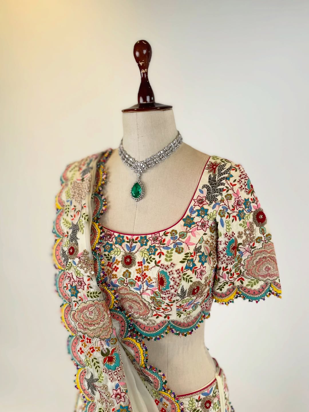 BEIGE RESHAM AND DORI HAND-EMBROIDERED LEHENGA EMBELLISHED WITH MULTI-COLOURED PEARLS