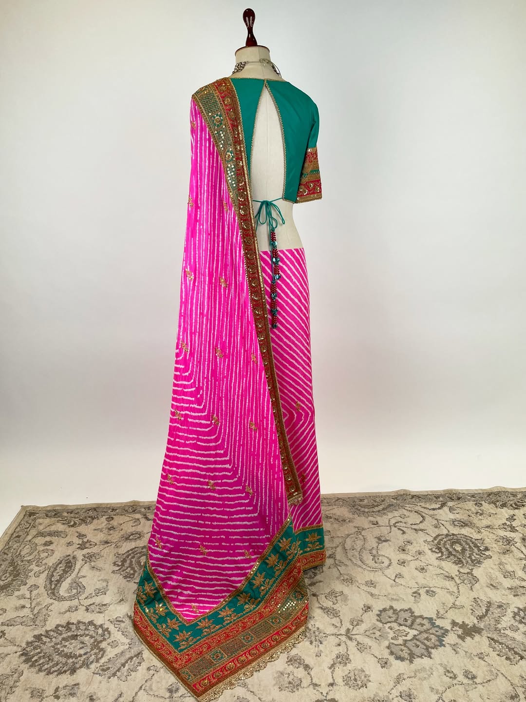 GREEN TEAL AND FUCHSIA PINK LEHERIYA RAI BANDHEJ GEORGETTE SAREE IN HERITAGE BRASS MARODI WORK