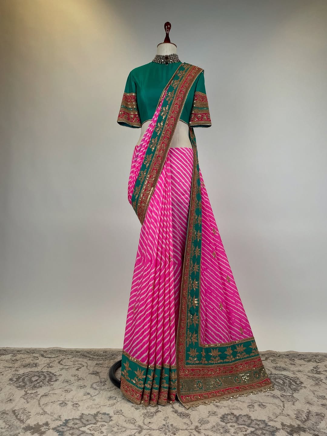 GREEN TEAL AND FUCHSIA PINK LEHERIYA RAI BANDHEJ GEORGETTE SAREE IN HERITAGE BRASS MARODI WORK