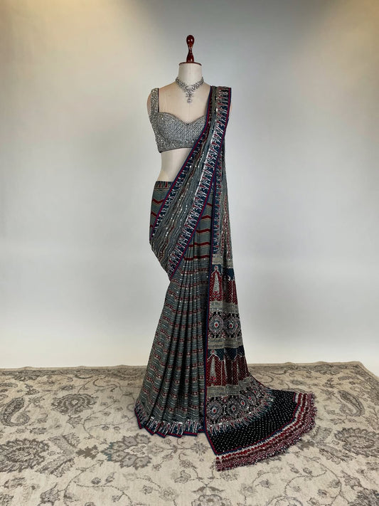 Bejewelled Natural Dye Ajrakh Saree with Statement Tassel Work  & Stone-Embellished Blouse