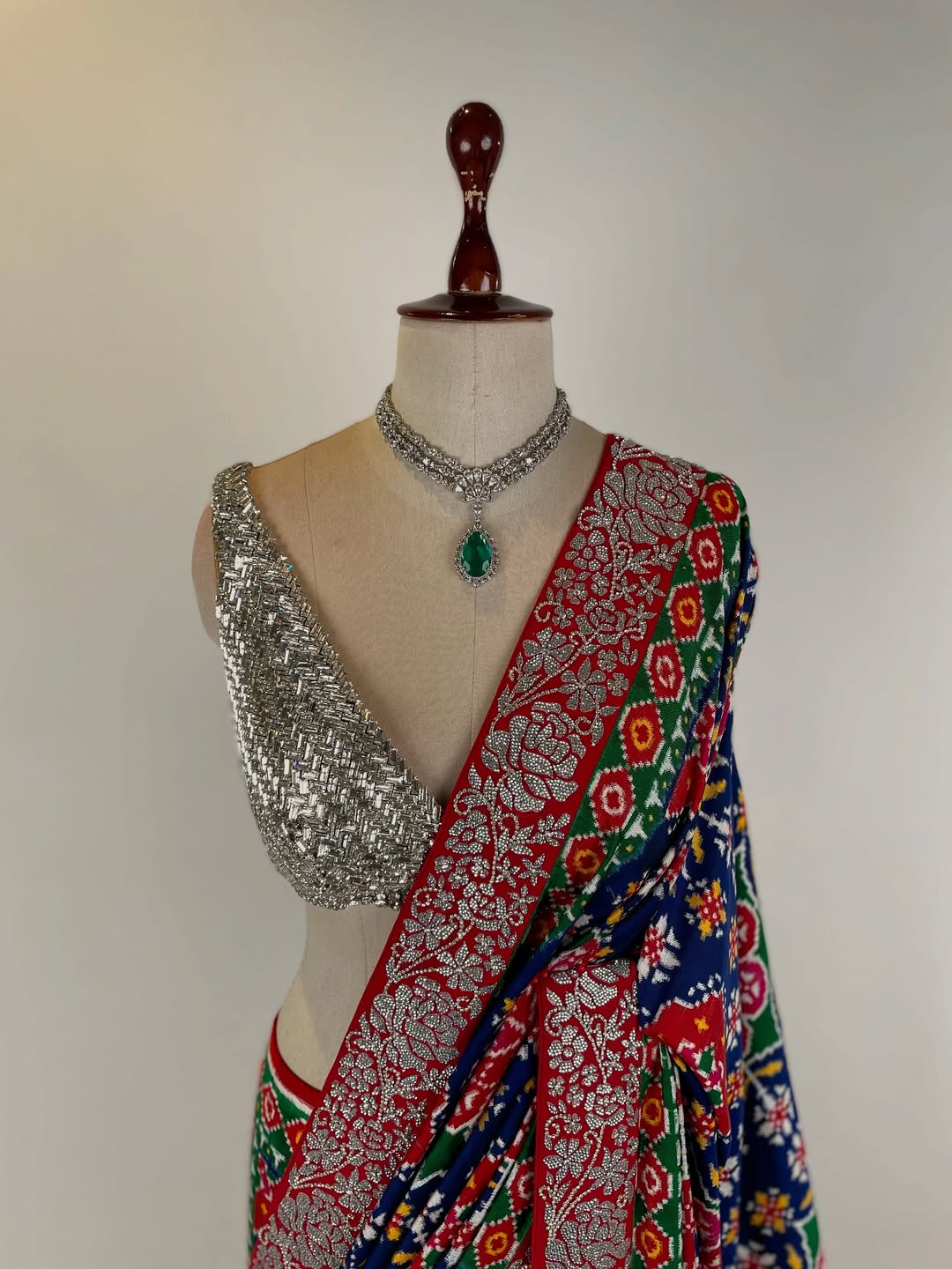 DOUBLE IKAT PATAN PATOLA SAREE WITH SWAROVSKI STONE STUDDED BORDER AND BLOUSE