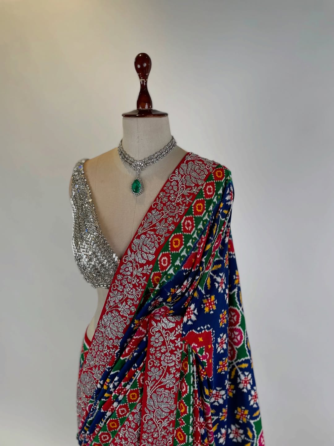DOUBLE IKAT PATAN PATOLA SAREE WITH SWAROVSKI STONE STUDDED BORDER AND BLOUSE