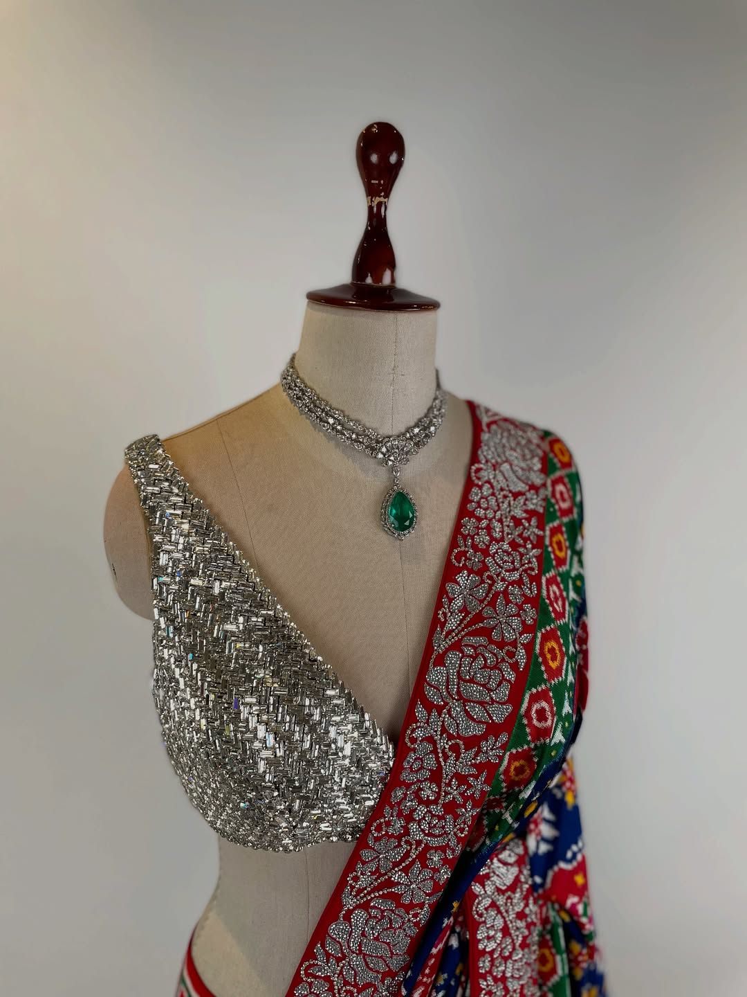 DOUBLE IKAT PATAN PATOLA SAREE WITH SWAROVSKI STONE STUDDED BORDER AND BLOUSE
