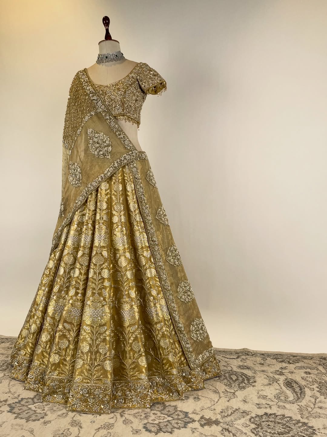 GOLD TISSUE BANARASI LEHENGA WITH ZARDOSI AND BEADS EMBELLISHED BLOUSE AND KOTA DORIA EMBROIDERED DUPATTA