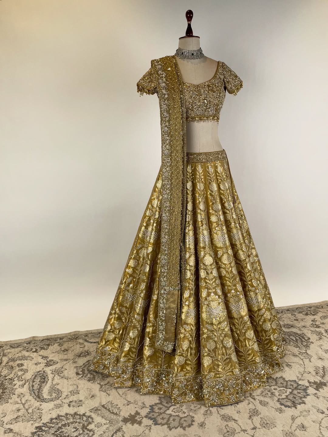 GOLD TISSUE BANARASI LEHENGA WITH ZARDOSI AND BEADS EMBELLISHED BLOUSE AND KOTA DORIA EMBROIDERED DUPATTA