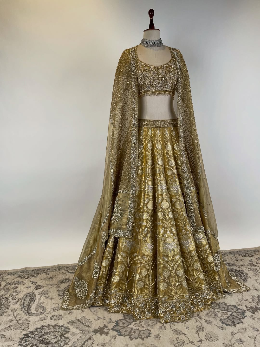 GOLD TISSUE BANARASI LEHENGA WITH ZARDOSI AND BEADS EMBELLISHED BLOUSE AND KOTA DORIA EMBROIDERED DUPATTA