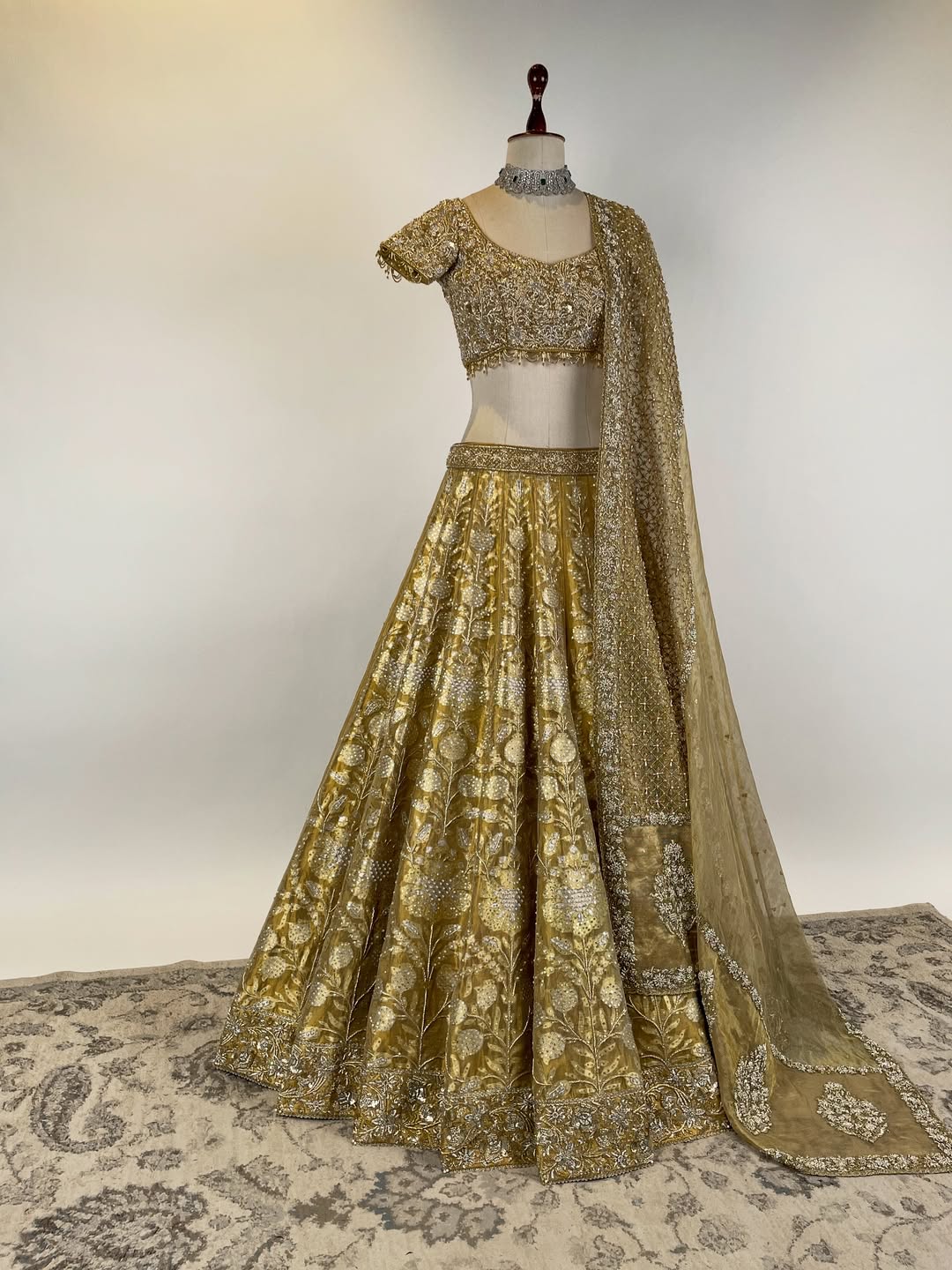 GOLD TISSUE BANARASI LEHENGA WITH ZARDOSI AND BEADS EMBELLISHED BLOUSE AND KOTA DORIA EMBROIDERED DUPATTA