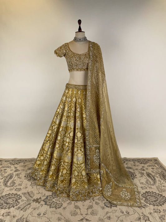 GOLD TISSUE BANARASI LEHENGA WITH ZARDOSI AND BEADS EMBELLISHED BLOUSE AND KOTA DORIA EMBROIDERED DUPATTA